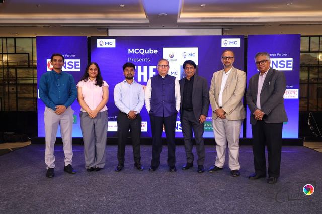 Speakers and organisers on stage at COMCLAVE Pune